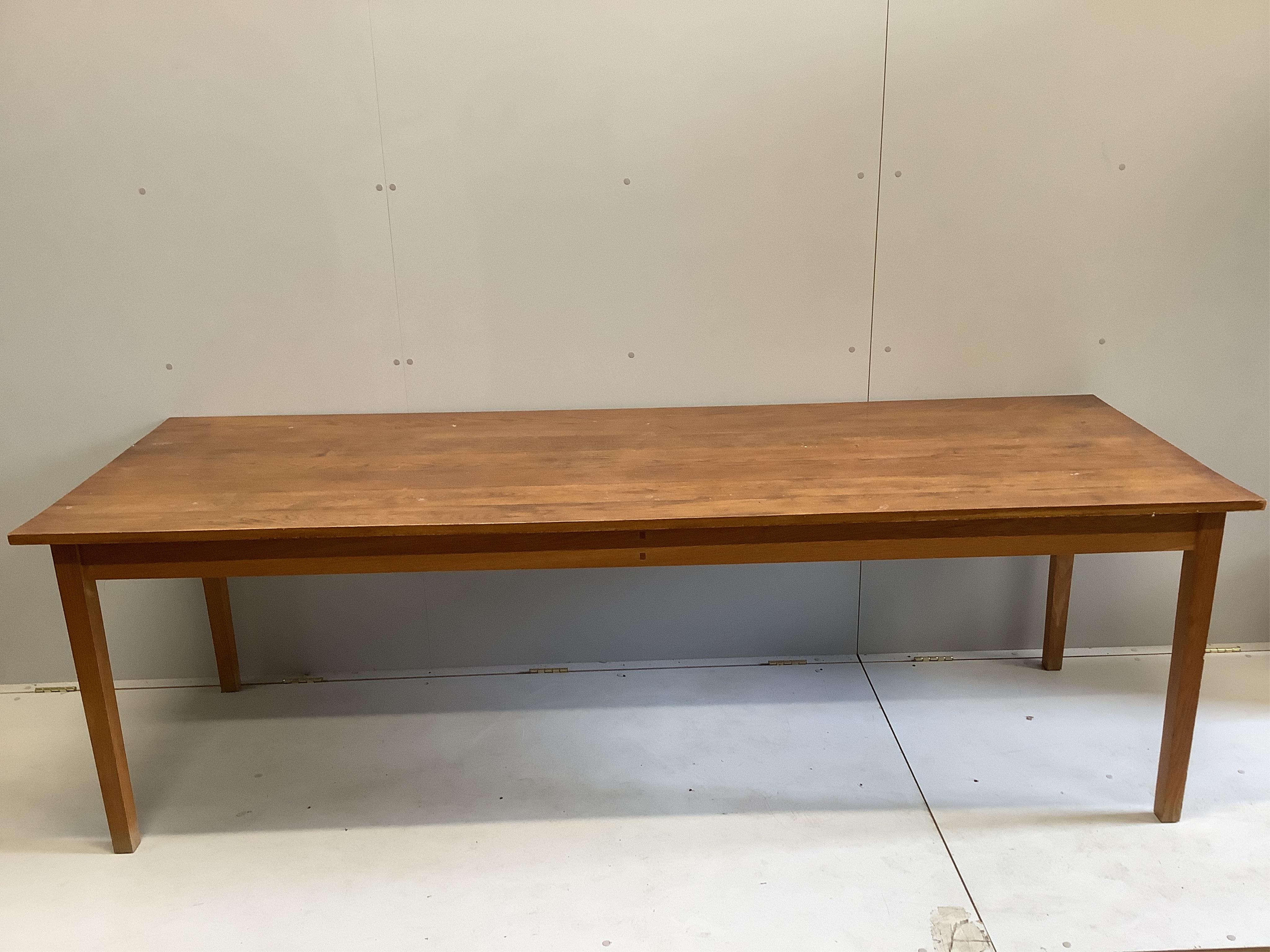 A mid century rectangular oak dining table with plank top, width 240cm, depth 84cm, height 74cm, together with a set of six beech dining chairs. Condition - fair